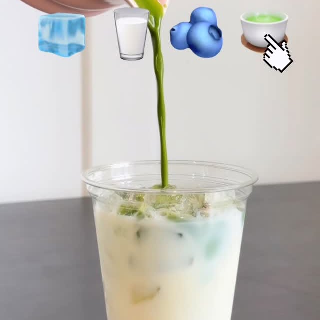 Matcha being poured over ice and milk to make a blueberry matcha latte