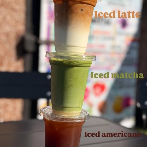Three iced drinks stacked on top of each other — an iced latte, an iced matcha and an iced americano